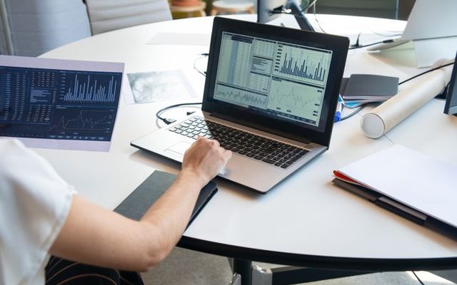 Figures worked through at a laptop