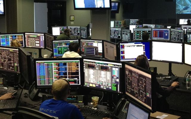 An operations floor of monitoring stations