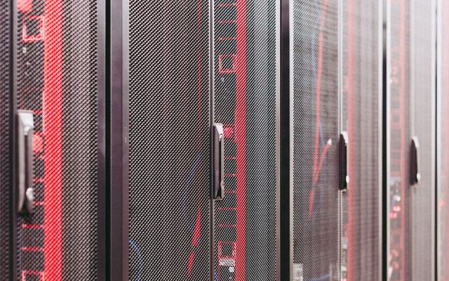 Servers seated in a lit data hall