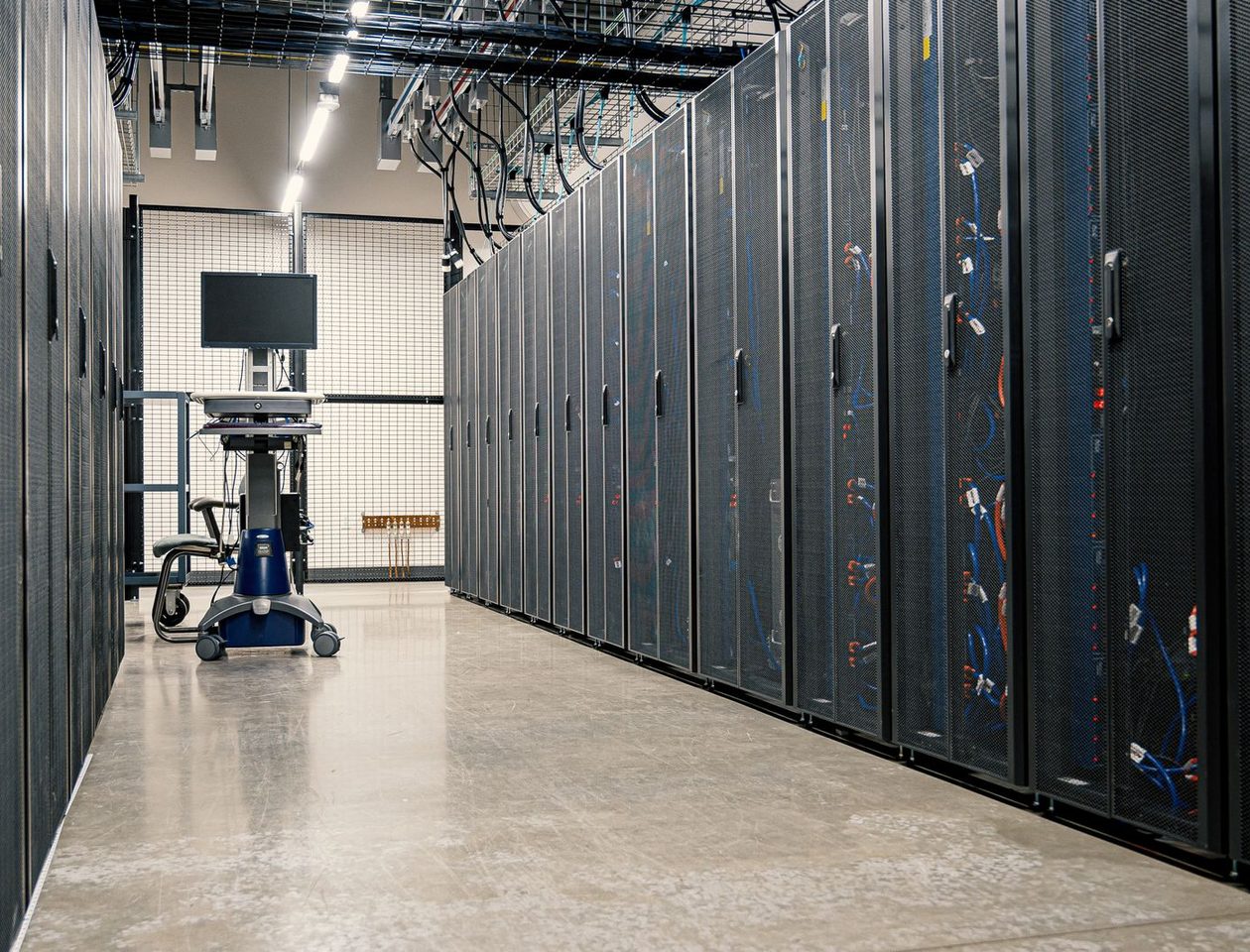 A data-centre aisle lined with equipment cabinets