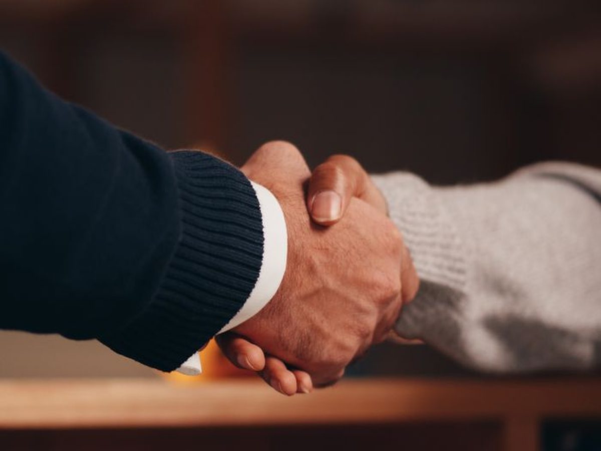 A handshake on completed work